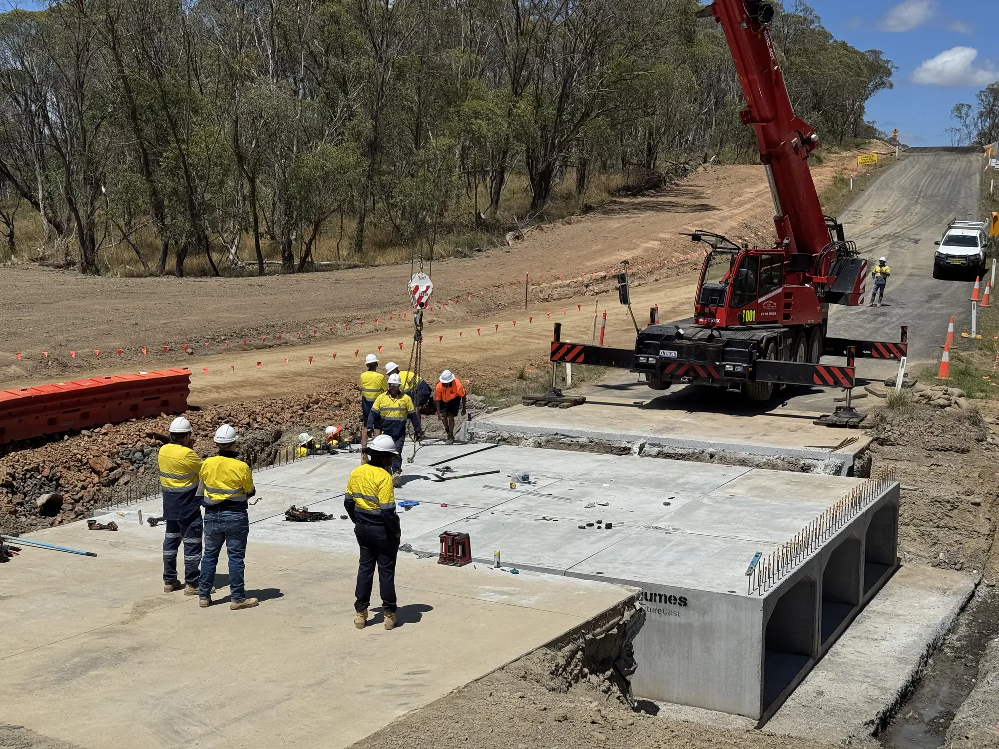 Stripes construction crew installing reinforced culverts at Rockvale Road