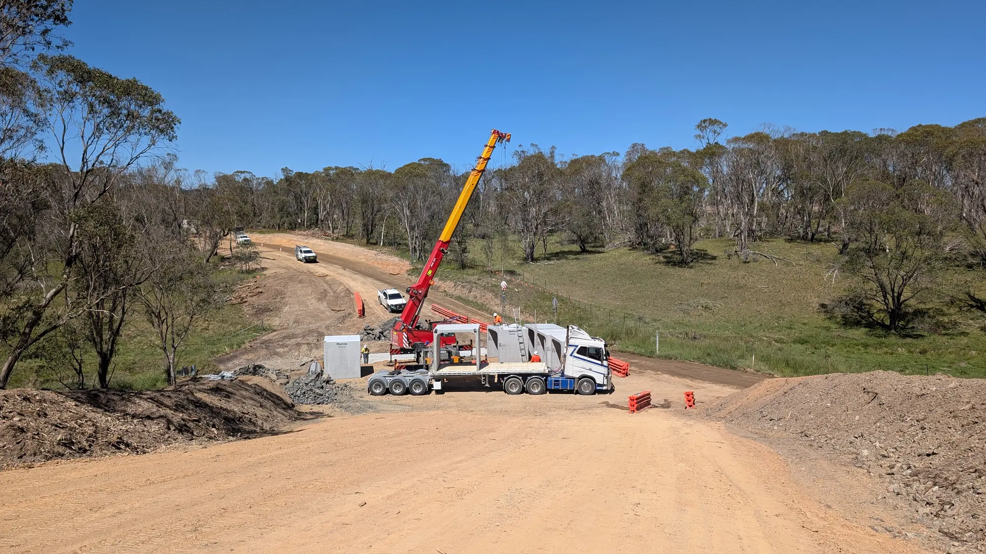 Crane unloading precast culvert units from a truck at the Rockvale Road works