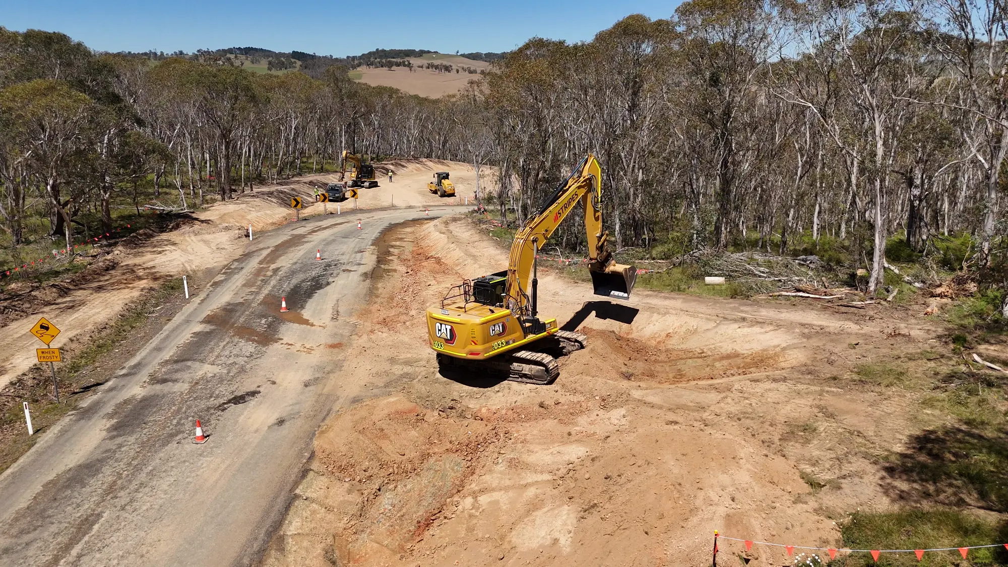 Stripes excavator completing earthworks beside the Rockvale Road alignment